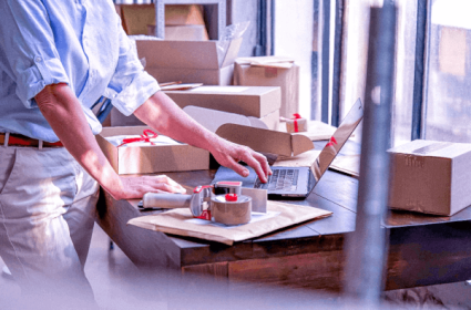 female-online-business-owner-packing-shipping-ecom-1-2 female-online-business-owner-packing-shipping-ecom-1-2